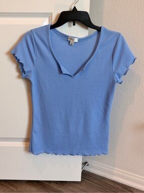 J for Justify blue top